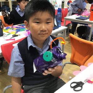 student with an invention